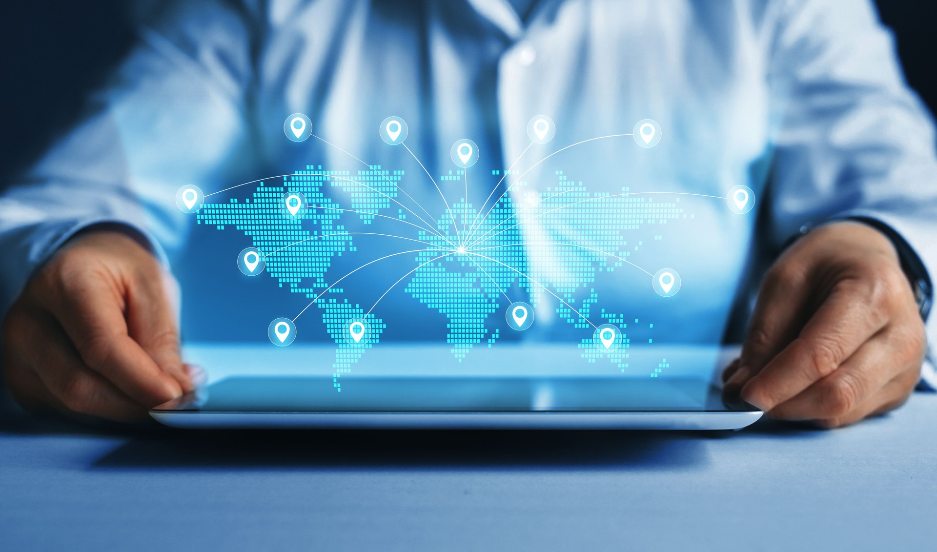 Business woman using tablet with futuristic digital world map with global business. Global Network Connection.E-commerce, online marketing and global business.